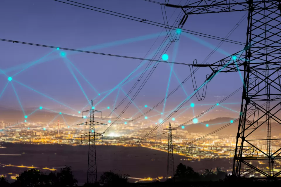 A grid of connected energy, shown as an imagined web over the night sky of an unnamed city.